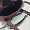 Sac à main Bauletto en cuir bordeaux avec motif peau de serpent pour femmes