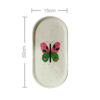 Plateau de service en béton artisanal avec motif papillon peint