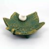 Bougeoir en poterie persane fait main avec design de feuille et oiseau