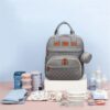 Sac à couches avec poches latérales pour accessoires bébé Modèle Lit Convertible