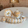 Service à thé en porcelaine victorienne avec motif papillon et floral, théière et soucoupe