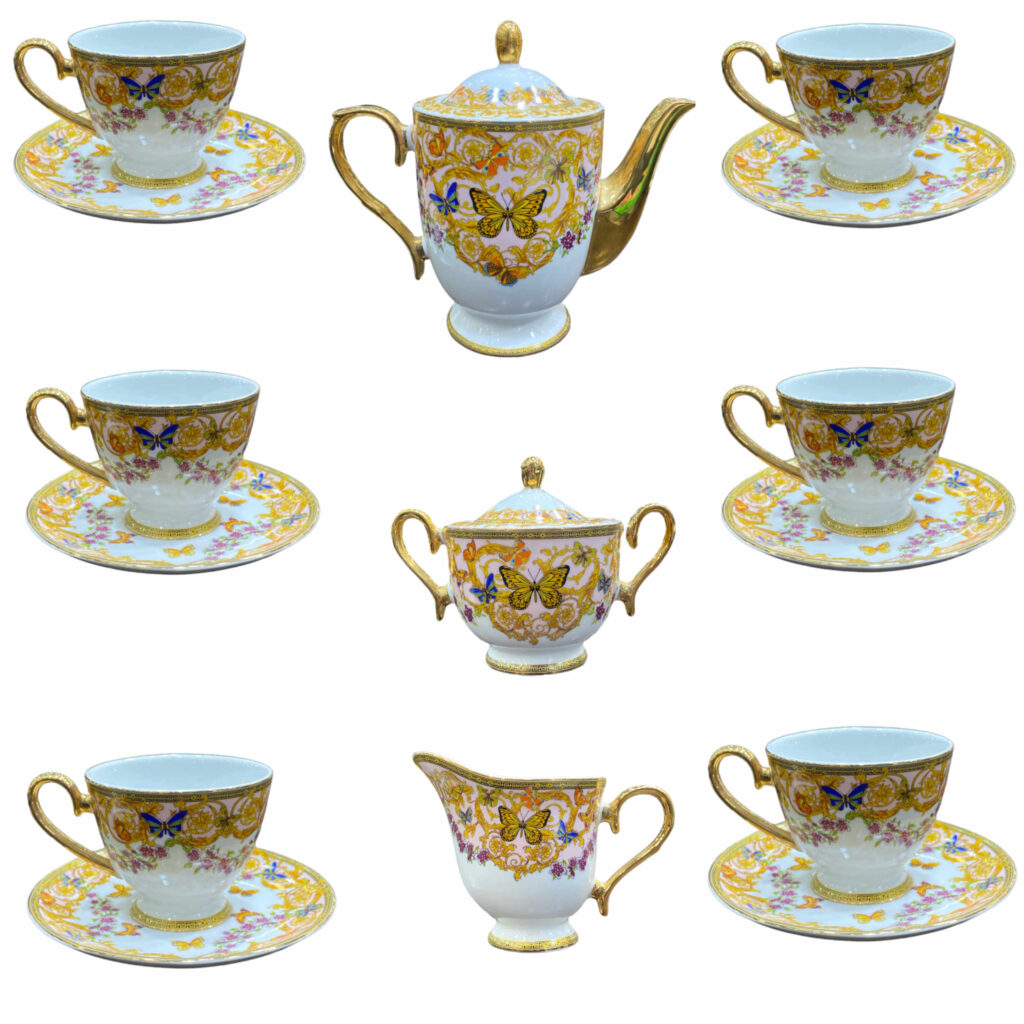 Service à thé en porcelaine victorienne avec motif papillon et floral, théière et soucoupe