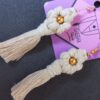 Boucles d'oreilles bohèmes en macramé chic, motif fleur.