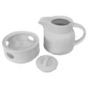 Théière de service en porcelaine élégante avec chauffe-théière en blanc