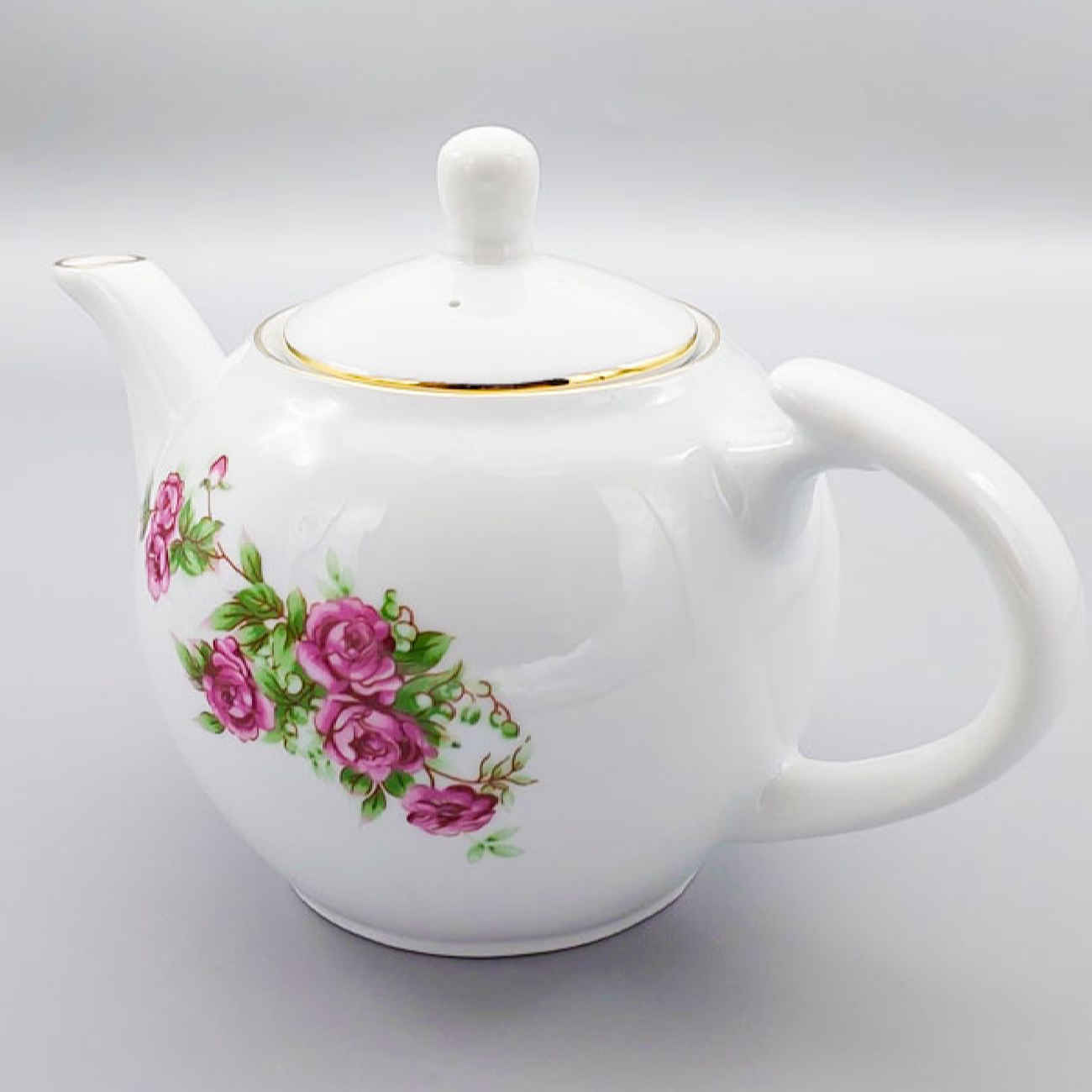 Théière de service en porcelaine avec design floral en blanc