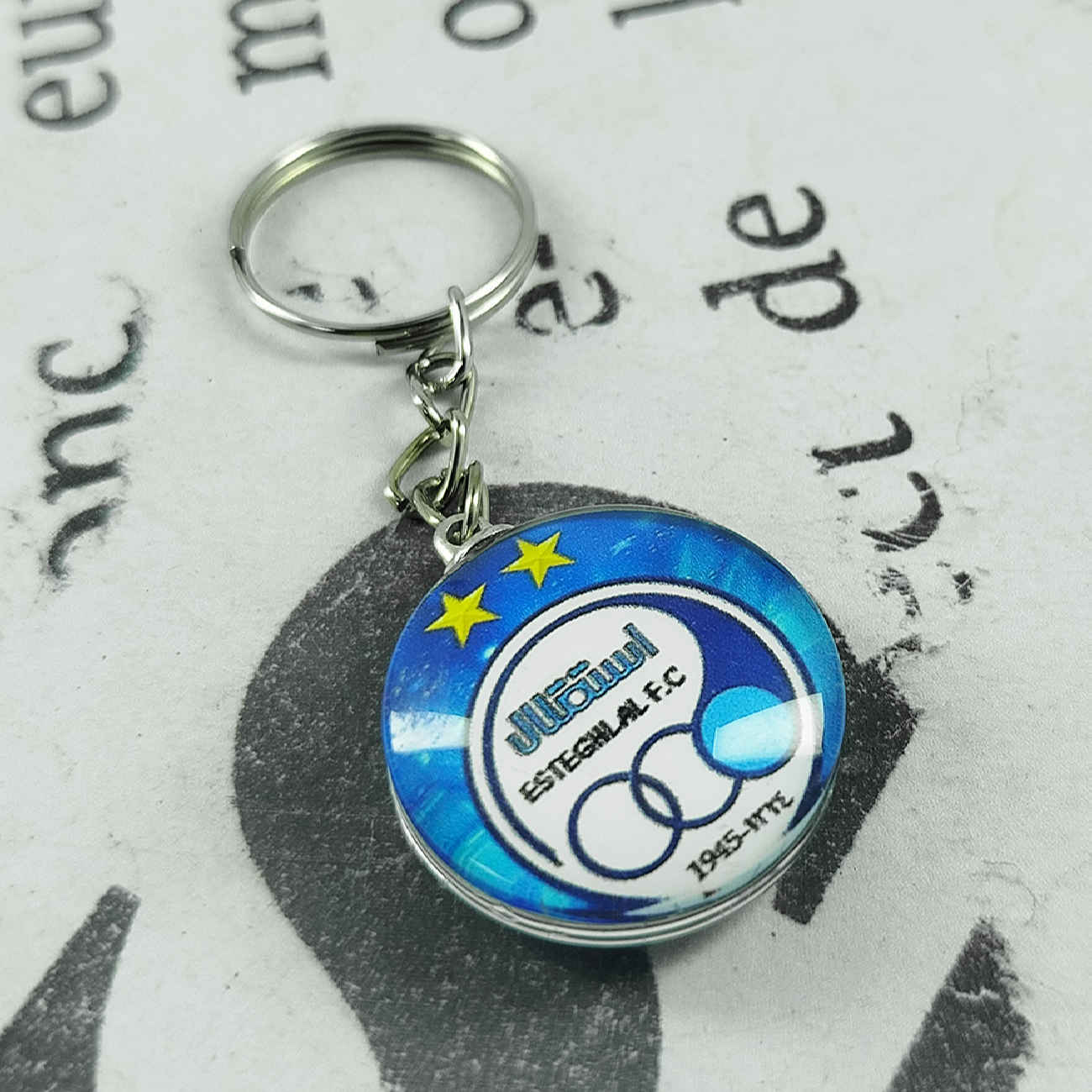 Porte-clés en verre Esteghlal – Un cadeau unique pour les passionnés de football