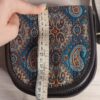 Sac à bandoulière Termeh rond fait main avec motifs héritage persan