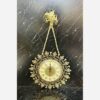 Charming-Brass-Wall-Clock-with-Decorative-Floral-Accents-and-Hanging-Detail