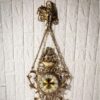 Grande horloge murale suspendue en laiton avec pendentif floral